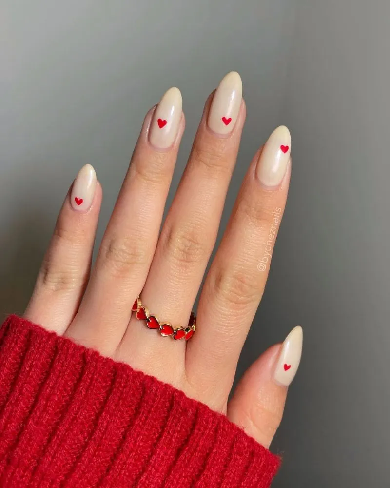 A soft and neutral cream-colored nail design with a sleek and elegant finish.