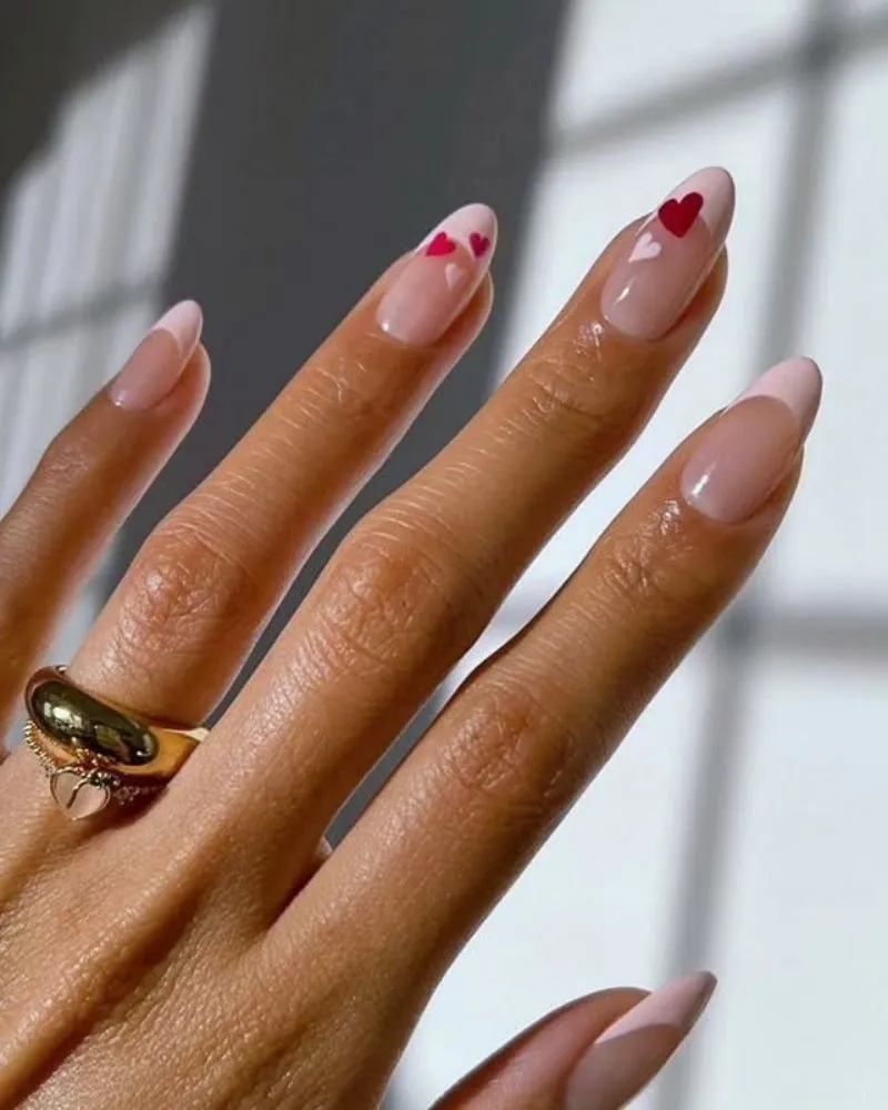 A delicate and feminine light pink French manicure for a soft, natural look.