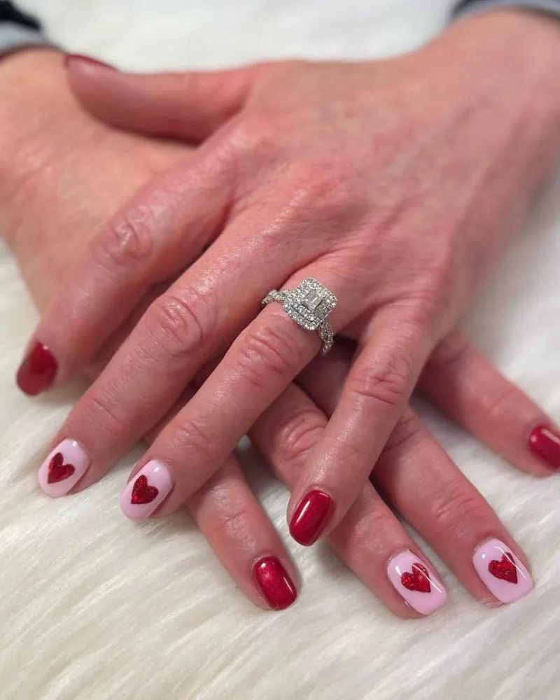 A minimalistic heart-themed nail design with a subtle yet chic appearance.