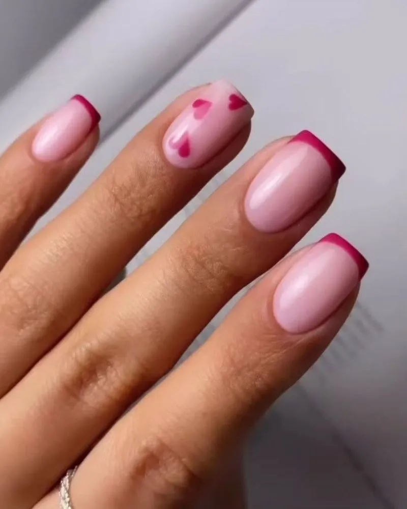 A soft and elegant pink French manicure with a minimalist touch.