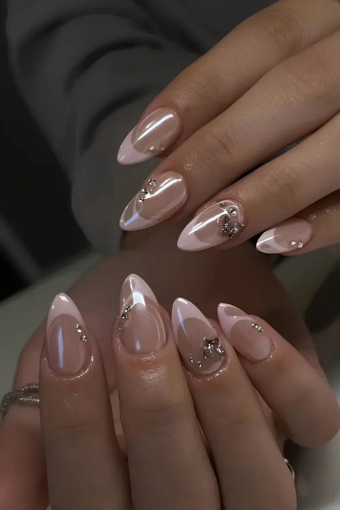 a unique swirly French tip design with a soft pink base and glossy white tips