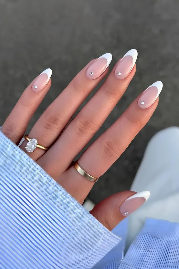 White French Tip Nails with Rhinestone Accents